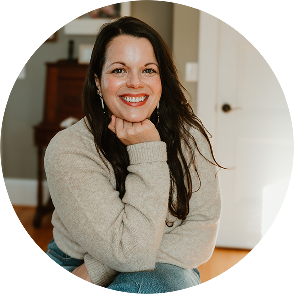 Headshot of Miranda Fredrick, Licensed Clinical Social Worker and therapist, smiling warmly, wearing a cozy casual outfit, with a friendly homey background.
